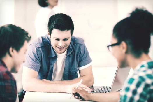 education concept - group of students studying at school