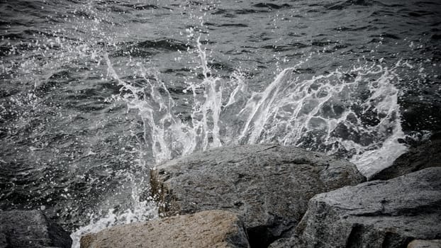 Storm of life concept, Water splashing at stone