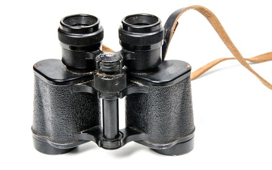 Old binoculars isolated on white background