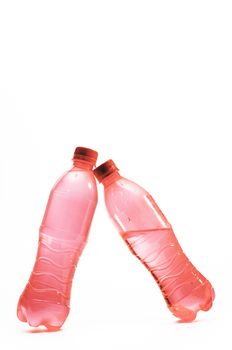 Pink water bottle lean together, Object isolated