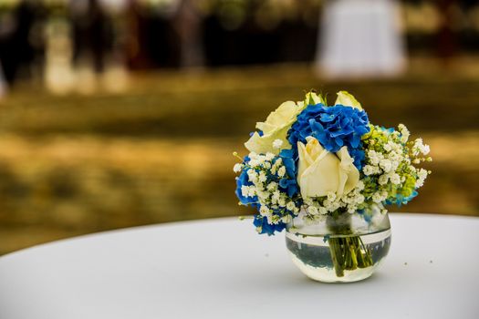 wedding set up in garden inside beach. Closeup of flowers