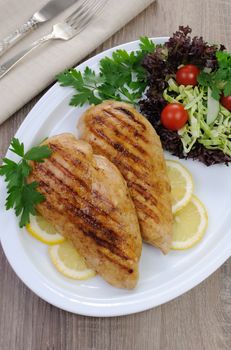 chicken breasts grilled garnish of salad vegetables