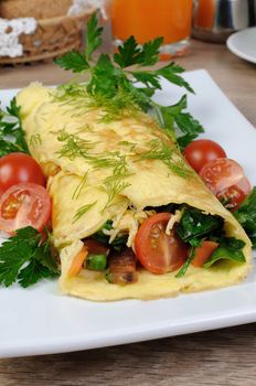Omelet stuffed  vegetables with herbs and tomatoes