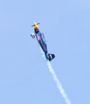 Plasy, Czech Republic - April 27, 2013: Peter Besenyei from Hungary on the Airshow "The Day on Air". His aircraft is painted in the colors of Red Bull energy drink for sponsorship reasons