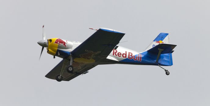 Plasy, Czech Republic - April 27, 2013: The Flying Bulls Aerobatics Team on the Airshow "The Day on Air". The team fly four modified Zlin Z-50 LX aircraft, painted in the colors of Red Bull energy drink for sponsorship reasons