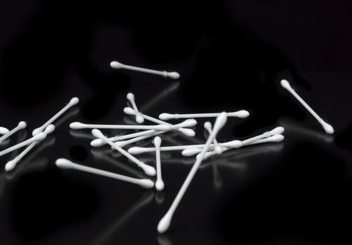 Cotton Swabs on Black Background bouncing.