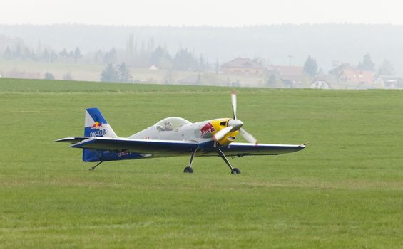 Plasy, Czech Republic - April 27, 2013: The Flying Bulls Aerobatics Team on the Airshow "The Day on Air". The team fly four modified Zlin Z-50 LX aircraft, painted in the colors of Red Bull energy drink for sponsorship reasons