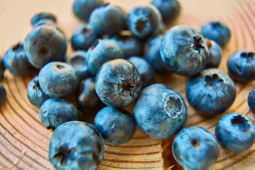 Freshly picked blueberries on wooden background. Shallow dof