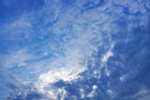 The blue sky and beautiful white clouds.