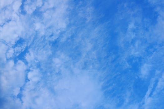 The blue sky and beautiful white clouds.