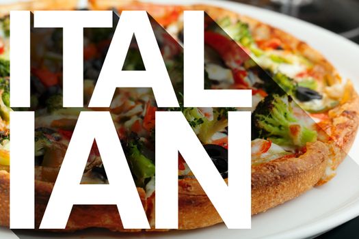 The word Italian with long shadow effect in front of a pizza with a variety of toppings.