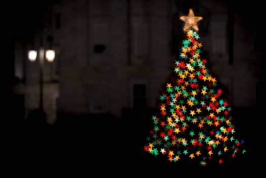 softly focused and blurred holiday and christmas lights on a christmas tree