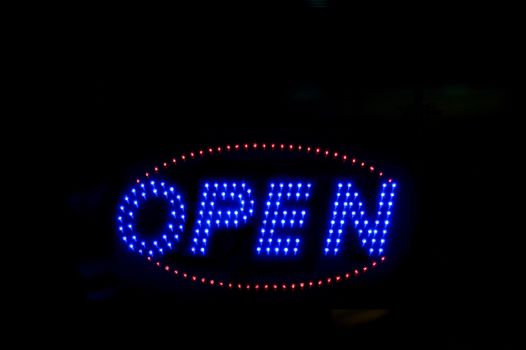 Brightly lit open neon signage