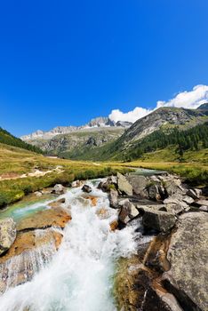 Peak of Care Alto (3462 m) and Chiese river in the National Park of Adamello Brenta seen from the Val di Fumo. Trentino Alto Adige, Italy