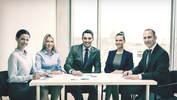 business and office concept - smiling business team at meeting