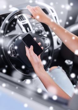 transportation, people, technology and vehicle concept - close up of woman using smartphone while driving car