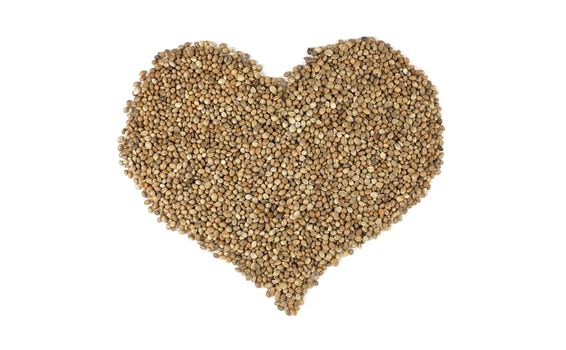 Hemp seeds in a heart shape, isolated on a white background