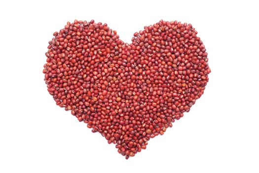 Red adzuki beans in a heart shape, isolated on a white background