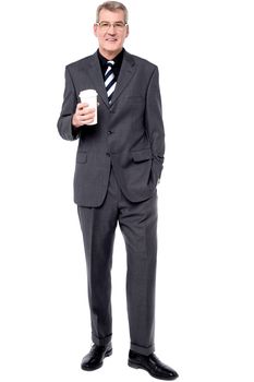 Business man with paper cup over white background