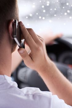 transportation, people, technology and vehicle concept - close up of man using smartphone while driving car