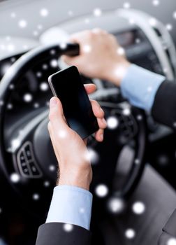 transportation, people, technology and vehicle concept - close up of man using smartphone while driving car