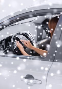 transportation, people, technology and vehicle concept - close up of woman using smartphone while driving car