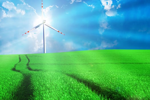 Windmill conceptual image. Windmill on the green sunny field.