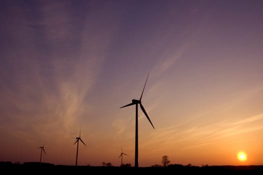 Windmill conceptual image. Windmills in sundown.