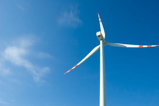 Clean energy. Windmill against the blue sky