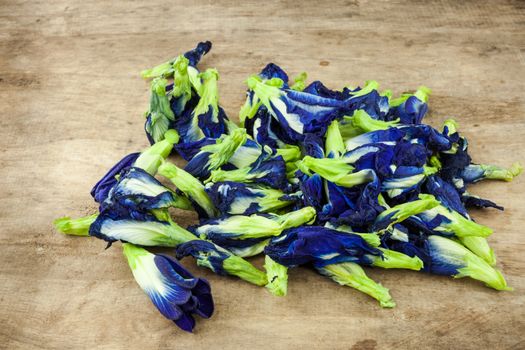 Fresh Butterfly pea flower, Clitoria ternatea on wooden plank.