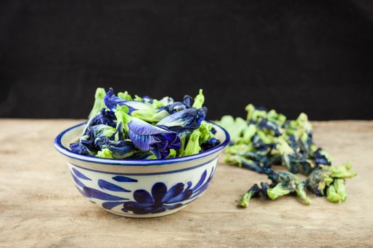 Fresh Butterfly pea flower, Clitoria ternatea on wooden plank.