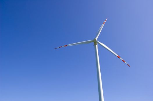 Windmill conceptual image.Windmill against the blue sky.