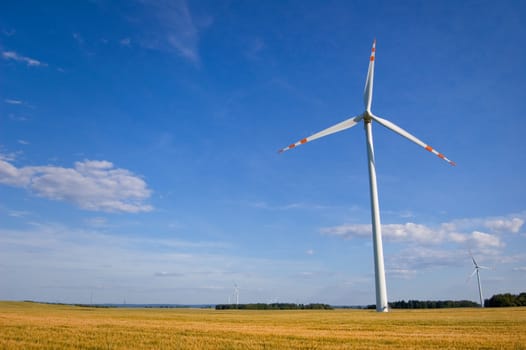 Windmill conceptual image. Windmill on the field.