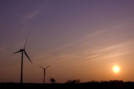 Windmill conceptual image. Windmills in sundown.