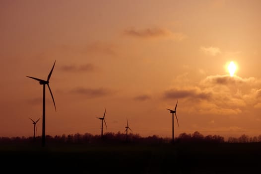 Windmill conceptual image. Windmills in sundown.