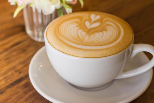 Coffee latte art on the wood desk