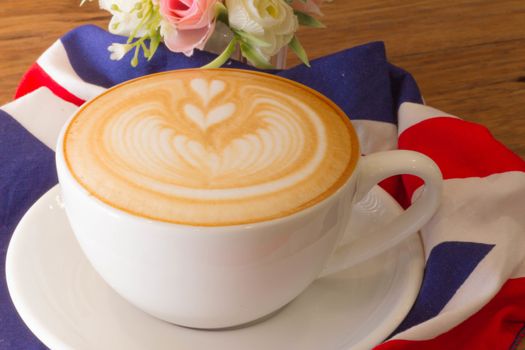 Coffee latte art on the wood desk