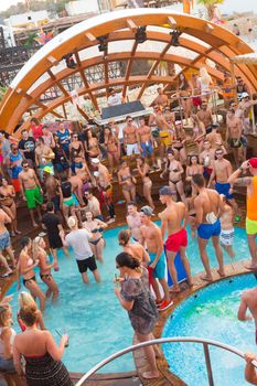 Croatia, Pag Island - July 25, 2015: Crowd of young people partying on a hot summer day on Zrce beach, Novalja, Pag island, Croatia. Zrce beach is the most popular party destination on Adriatic sea.