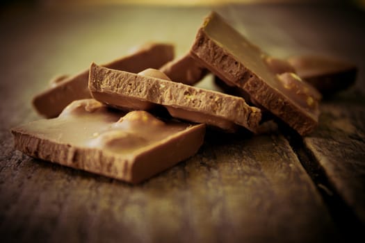 Chocolate pieces on a wooden table