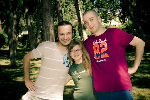 Latest winners posing happy in a forest