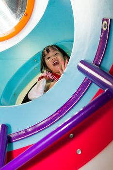 Asian Chinese Girl having funtime at Playground.