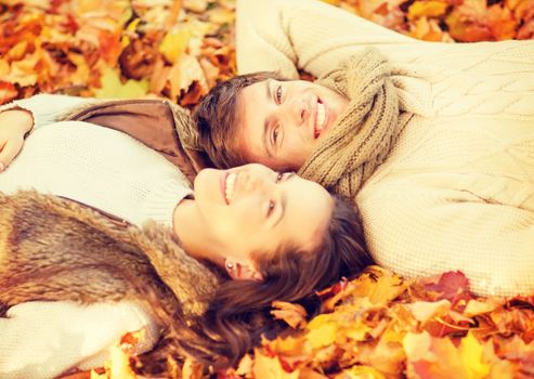 holidays, love, travel, relationship and dating concept - romantic couple in the autumn park