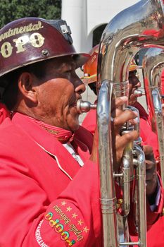 SAO PAULO, BRAZIL August 9 2015: An unidentified man with typical costumes playing a typical music instrument during the Morenada parade in Bolivian Independence Day celebration in Sao Paulo Brazil.