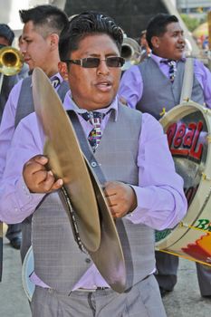 SAO PAULO, BRAZIL August 9 2015: An unidentified man with typical costumes playing a typical music instrument during the Morenada parade in Bolivian Independence Day celebration in Sao Paulo Brazil.