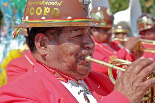 SAO PAULO, BRAZIL August 9 2015: An unidentified man with typical costumes playing a typical music instrument during the Morenada parade in Bolivian Independence Day celebration in Sao Paulo Brazil.