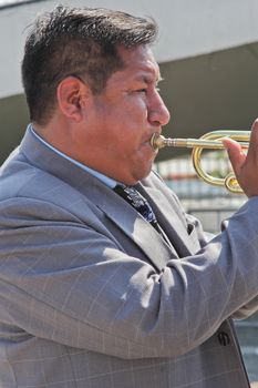 SAO PAULO, BRAZIL August 9 2015: An unidentified man with typical costumes playing a typical music instrument during the Morenada parade in Bolivian Independence Day celebration in Sao Paulo Brazil.