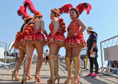 SAO PAULO, BRAZIL August 9 2015: An unidentified group of girls with typical costumes wait for the Morenada parade in Bolivian Independence Day celebration in Sao Paulo Brazil.