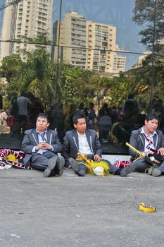 SAO PAULO, BRAZIL August 9 2015: An unidentified group of men resting after the Morenada parade in Bolivian Independence Day celebration in Sao Paulo Brazil.