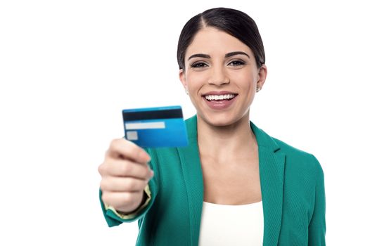 Female executive showing a cash card to camera