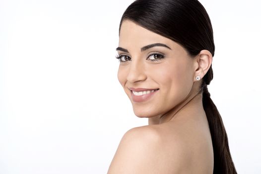 Bare shoulder woman posing to camera over white